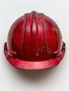 Old red hard hat on white background Royalty Free Stock Photo