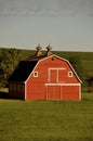 Old red hip roofed barn front Royalty Free Stock Photo