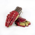 Old red hockey gloves for goalkeeper. Isolated over white background Royalty Free Stock Photo