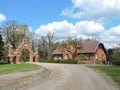 Old red home and gate , Lithuania Royalty Free Stock Photo