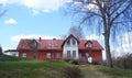 Old red home and trees, Latvia