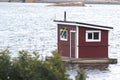 Old red house inwater with Sweden flag Royalty Free Stock Photo
