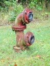 Old red hydrant as fire department connection for fire hose Royalty Free Stock Photo