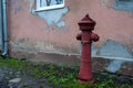 Old red hydrant. Vintage fire hydrant. Royalty Free Stock Photo