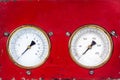Old red industry panel with two analog meters Royalty Free Stock Photo