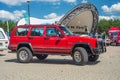 Old red Jeep Cherokee car parked Royalty Free Stock Photo