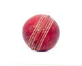 Old red leather cricket ball isolated against a white background Royalty Free Stock Photo