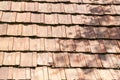 Old red and orange weathered roof tiles texture. Close-up Royalty Free Stock Photo