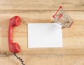 Red old fashioned telephone receiver on wooden table Royalty Free Stock Photo