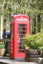 Old red pillar box on train platform