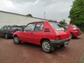 Old red popular French car supermini Peugeot 205 Junior parked Royalty Free Stock Photo