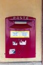 Old red postbox wall mounted