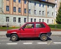 Old red private small city compact car Fiat Panda 45 parked