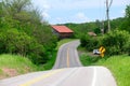 Old red roof barn near highway Royalty Free Stock Photo