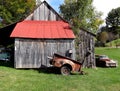 Old Red Roof Barn with Old Car Royalty Free Stock Photo