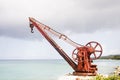 Old Red Rusty Crane on Shore