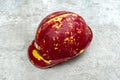 Old Red safety helmet with clipping path isolated on a concrete floor Royalty Free Stock Photo