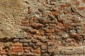 Old red sandstone brick wall worn by time. Royalty Free Stock Photo