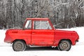 Old red small retro car on street in winter Royalty Free Stock Photo