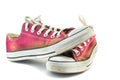 Old red sneakers on white Royalty Free Stock Photo