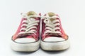 Old red sneakers on white Royalty Free Stock Photo