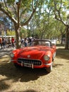 Old red sport 1957 Chevrolet Corvette C1 roadster in a park. Autoclasica 2022 classic car show.