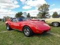 Old red sport Chevrolet Corvette C3 Stingray two door convertible circa 1970. Classic muscle car Royalty Free Stock Photo