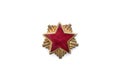 Old red star from military cap isolated on the white background