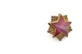 Old red star from military cap isolated on the white background