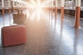 old red suitcase, baggage or luggage on platform at train station. journey, trip, travel concept Royalty Free Stock Photo