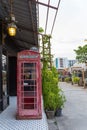 Old red telephone booth at night market, Srinakarin road, Thailand