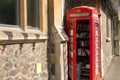 An old red telephone box, used as a community library, Malvern, Worcestershire, UK Royalty Free Stock Photo
