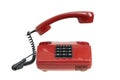 Old red telephone, isolated. Vintage red phone with taken off receiver Royalty Free Stock Photo