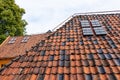Old red tile roofs with a small windows