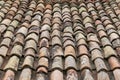 Old red tiles roof. Closeup top view background.