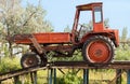 Old red tractor in the countryside