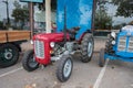 old red tractor parked on the street, it is a Massey Ferguson model 35 Royalty Free Stock Photo