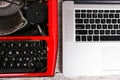 Old typewriter maschine and laptop on table. Concept of technology progress Royalty Free Stock Photo