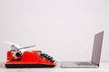 Old typewriter and laptop on table. Concept of technology progress Royalty Free Stock Photo