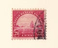 An old red usa postage stamp with an image of the golden gate straights in san francisco