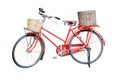 Old red vintage bicycle with rattan baskets isolated on white ba