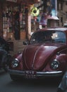 Old Red Volkswagen Beetle Oval Car Crossing Crowded Thamel Street Royalty Free Stock Photo