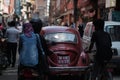 Old Red Volkswagen Beetle Oval Car Crossing Crowded Thamel Street Royalty Free Stock Photo