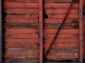 Old red wall of empty abandoned Soviet train car Royalty Free Stock Photo