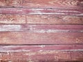 Old red wall made of wood. An old painted surface made of wood for design and creativity. Texture of an old red painted board made Royalty Free Stock Photo