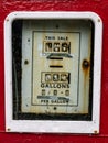 An Old Red and White Fuel Pump Gallon Display