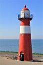 An old red and white lighthouse in Westkapelle, Netherlands