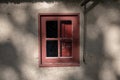 Old red window under the sunlight Royalty Free Stock Photo