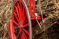 Old red wood and metal wagon wheel Royalty Free Stock Photo