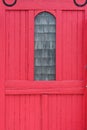 Old red wood sliding door with window in Wellfleet Cape Cod MS Royalty Free Stock Photo